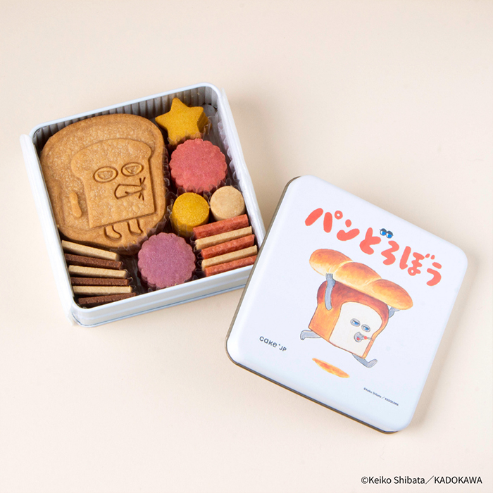 大人気の絵本の表紙をデザインした缶を開けると、パンどろぼうと食パンを再現したオリジナルクッキーが！